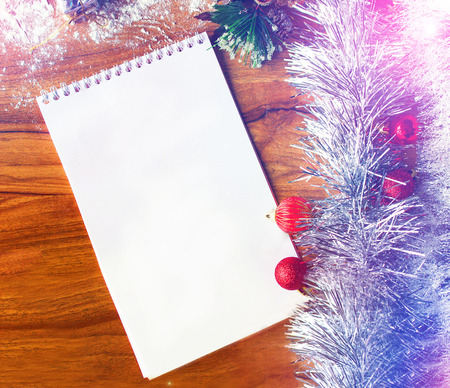 White notepad. Happy new year.New Year's goals with colorful decorations. Soft, gentle lighting effects.の写真素材