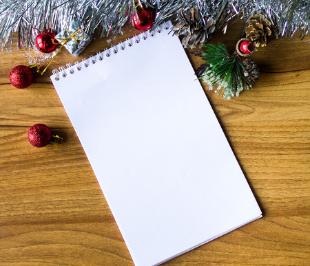 White notepad. Happy new year.New Year's goals with colorful decorations. Soft, gentle lighting effects.の写真素材
