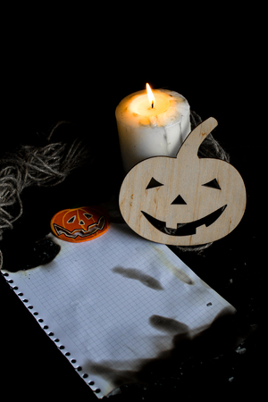Halloween with candles and pumpkins from a tree. The place for the letter, inscriptionsの写真素材