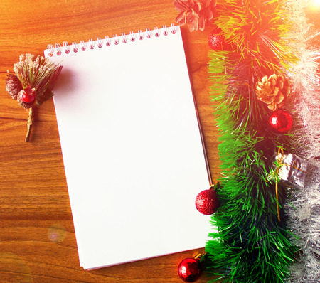 White notepad. Happy new year.New Year's goals with colorful decorations. Soft, gentle lighting effects.の写真素材