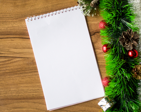 White notepad. Happy new year.New Year's goals with colorful decorations. Soft, gentle lighting effects.の写真素材