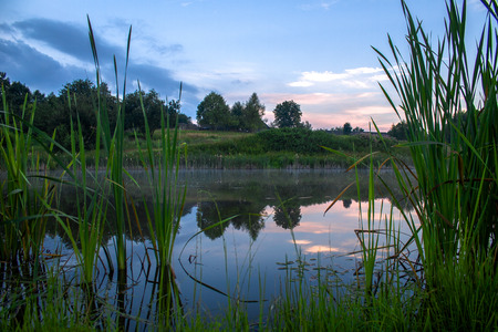 Lake Village, sunset on the lake and the forestの写真素材