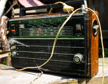Close up of an old radio.The old radio receiver with a webの写真素材