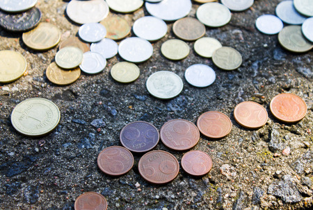 Coins close-up.A whole bunch of coins piled on top of one another to make this backgroundの写真素材