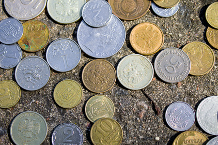 Coins close-up.A whole bunch of coins piled on top of one another to make this backgroundの写真素材
