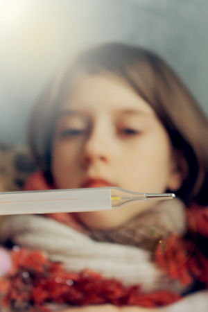 small child falls ill, treatment and prevention, soft light effectの写真素材