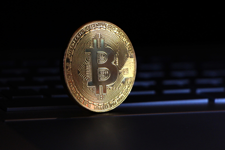 Bitcoin close-up on keyboard background.の写真素材