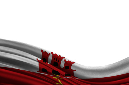 Grunge colorful flag Gibraltar with copyspace for your text or images,isolated on white background. Close up, fluttering downwind.の写真素材