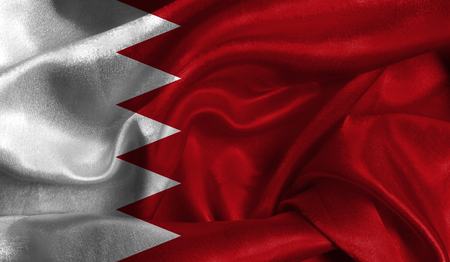 Realistic flag of Bahrain on the wavy surface of fabric. This flag can be used in design.の写真素材