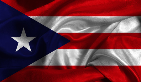 Realistic flag of Puerto Rico on the wavy surface of fabric.の写真素材