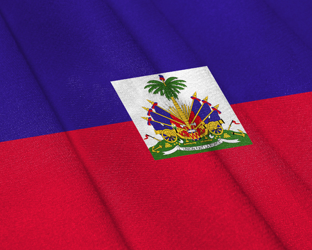 Realistic flag of Haiti on the wavy surface of fabric. This flag can be used in designの写真素材