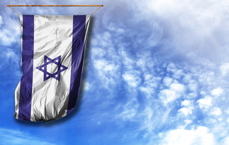 Flag of Israel. Vertical flag, against blue sky with place for your textの写真素材