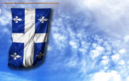 Flag of Quebec. Vertical flag, against blue sky with place for your text