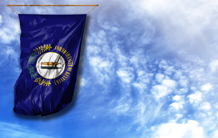 Flag State of Kentucky. Vertical flag, against blue sky with place for your textの写真素材