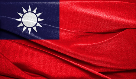 Realistic flag of Taiwan on the wavy surface of fabric. Perfect for background or texture purposes.の写真素材