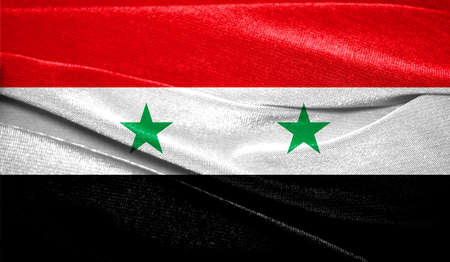 Realistic flag of Syria on the wavy surface of fabric. Perfect for background or texture purposes.の写真素材