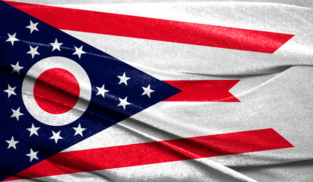 Realistic flag State of Ohio on the wavy surface of fabric. Perfect for background or texture purposes.の写真素材