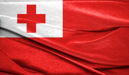 Realistic flag of Tonga on the wavy surface of fabric. Perfect for background or texture purposes.の写真素材