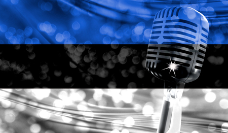 Microphone on a background of a blurry Estonia flag close-upの写真素材