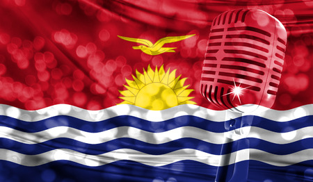 Microphone on a background of a blurry Kiribati flag close-upの写真素材