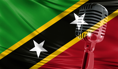 Microphone on fabric background of flag of Saint Kitts and Nevis close-upの写真素材