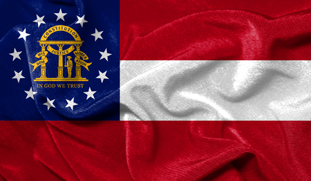 Realistic flag State of Georgia on the wavy surface of fabricの写真素材
