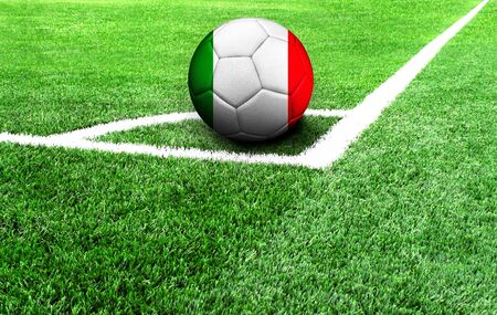 soccer ball on a green field, flag of Italyの写真素材