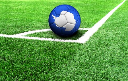 soccer ball on a green field, flag of Antarcticの写真素材
