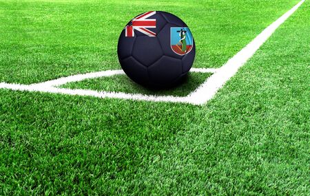 soccer ball on a green field, flag of Montserratの写真素材