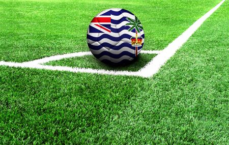 soccer ball on a green field, flag of British Territory in the Indian Oceanの写真素材