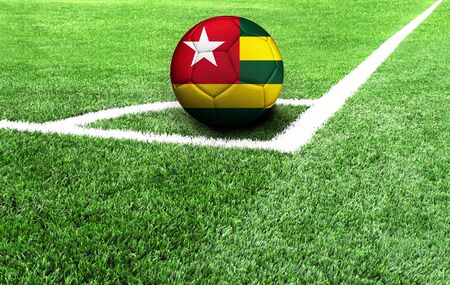 soccer ball on a green field, flag of Togoの写真素材