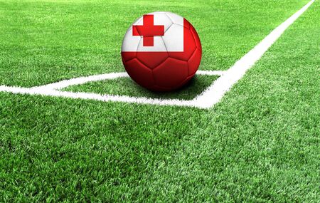 soccer ball on a green field, flag of Tongaの写真素材