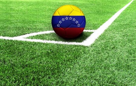soccer ball on a green field, flag of Venezuelaの写真素材