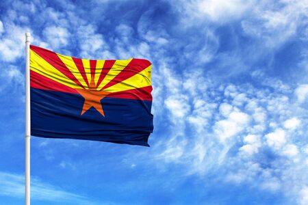 National flag State of Arizona on a flagpole in front of blue skyの写真素材