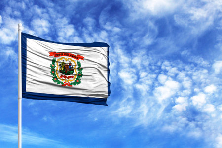 National flag State of West Virginia on a flagpole in front of blue skyの写真素材