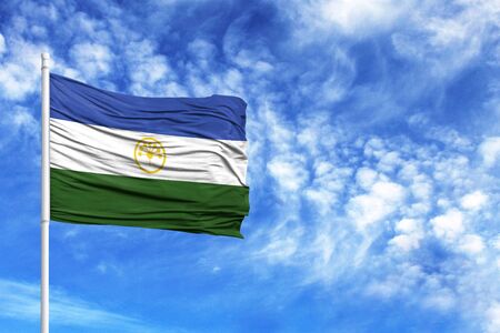 National flag of Bashkortostan on a flagpole in front of blue skyの写真素材