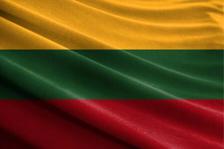 Realistic flag of Lithuania on the wavy surface of fabricの写真素材