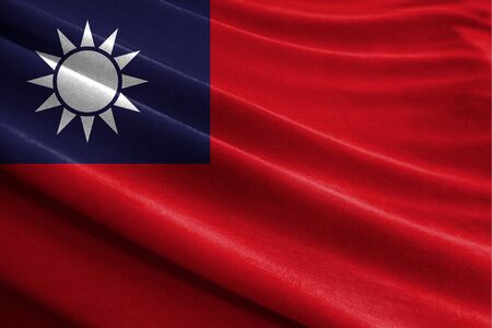 Realistic flag of Taiwan on the wavy surface of fabricの写真素材