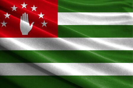 Realistic flag of Abkhazia on the wavy surface of fabricの写真素材
