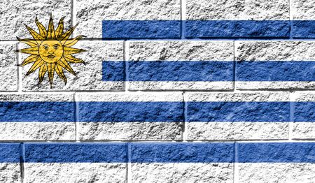Flag of Uruguay close up painted on a cracked wallの写真素材