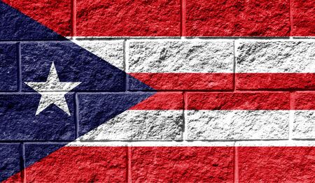 Flag of Puerto Rico close up painted on a cracked wallの写真素材