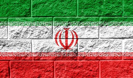 Flag of Iran close up painted on a cracked wallの写真素材