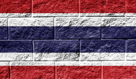 Flag of Thailand close up painted on a cracked wallの写真素材