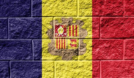 Flag of Andorra close up painted on a cracked wallの写真素材
