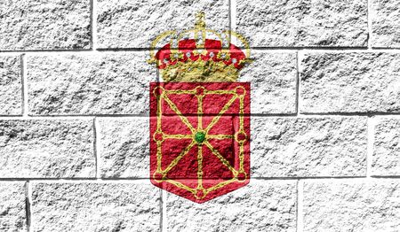 Flag of Navarra coat of arms close up painted on a cracked wallの写真素材