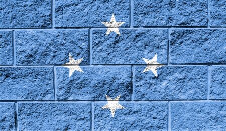 Flag of Micronesia close up painted on a cracked wallの写真素材