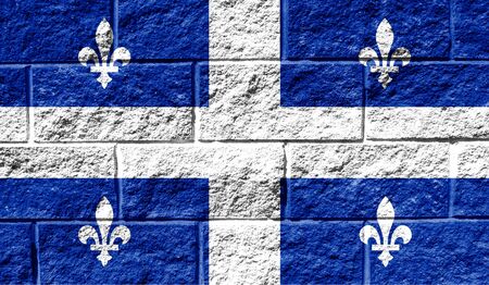 Flag of Quebec close up painted on a cracked wallの写真素材