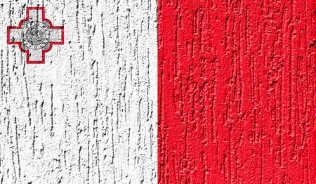 Flag of malta close up painted on a cracked wallの写真素材