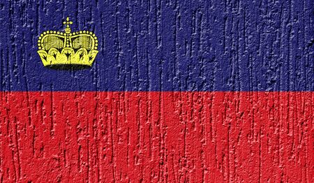 Flag of Liechtenstein close up painted on a cracked wallの写真素材
