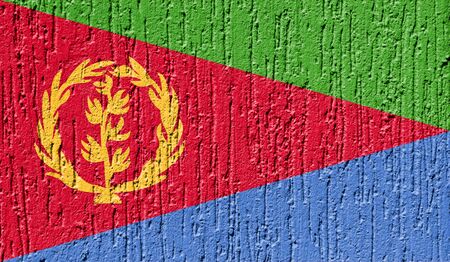 Flag of Eritrea close up painted on a cracked wallの写真素材